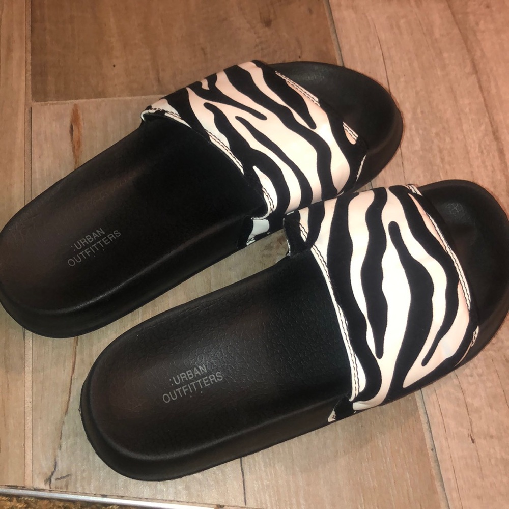 Black and white slip ons